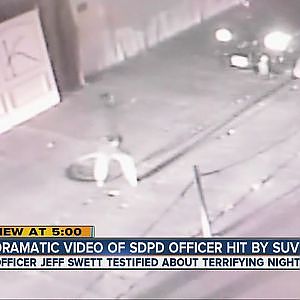VIDEO: SDPD officer hit by his own police car - YouTube