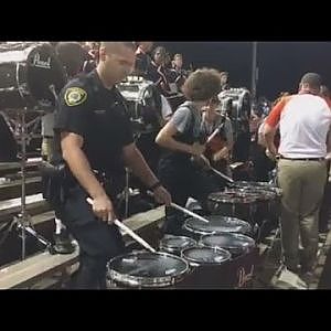 Watch Police Officer Join High School Marching Band For Impressive Drum Solo - YouTube