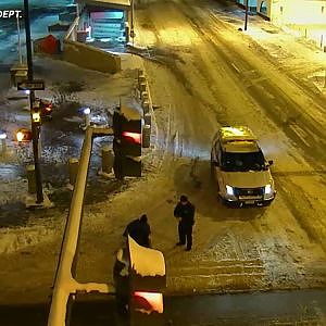 Police officer helps wheelchair-bound man across icy road - YouTube