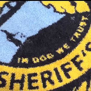 "In Dog We Trust" printed on Florida law enforcement office carpet - YouTube