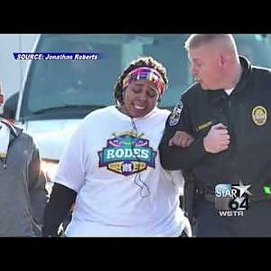 Police officer helps woman finish 10K - YouTube