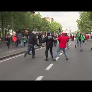 Horrific moment police chief is knocked out cold by protester during Brussels clashes - YouTube