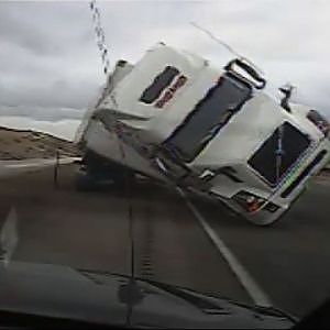 Raw: Big Rig Blows Over, Crushes Patrol Car - YouTube