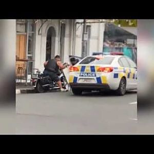 New Zealand police officer tackles biker - YouTube
